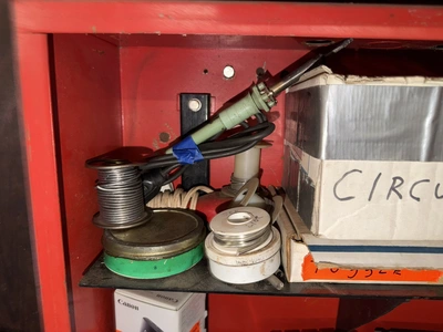 (2) Auto Call single door storage cabinets filled with assorted electrical items, including Push Mat...
