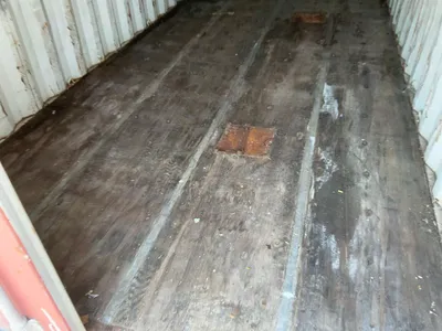 20’ Shipping / Storage Container 8’ wide x 8’ 6” tall, swing doors on one end, wood deck, rings for ...