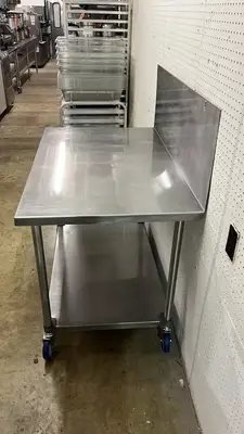 Used Falcon Restaurant Supply Used 48"x 30" Stainless Steel Table with Casters and a 16" Backsplash - FG Food Prep Tables Illinois US | Falcon Restaurant Supply #1374938