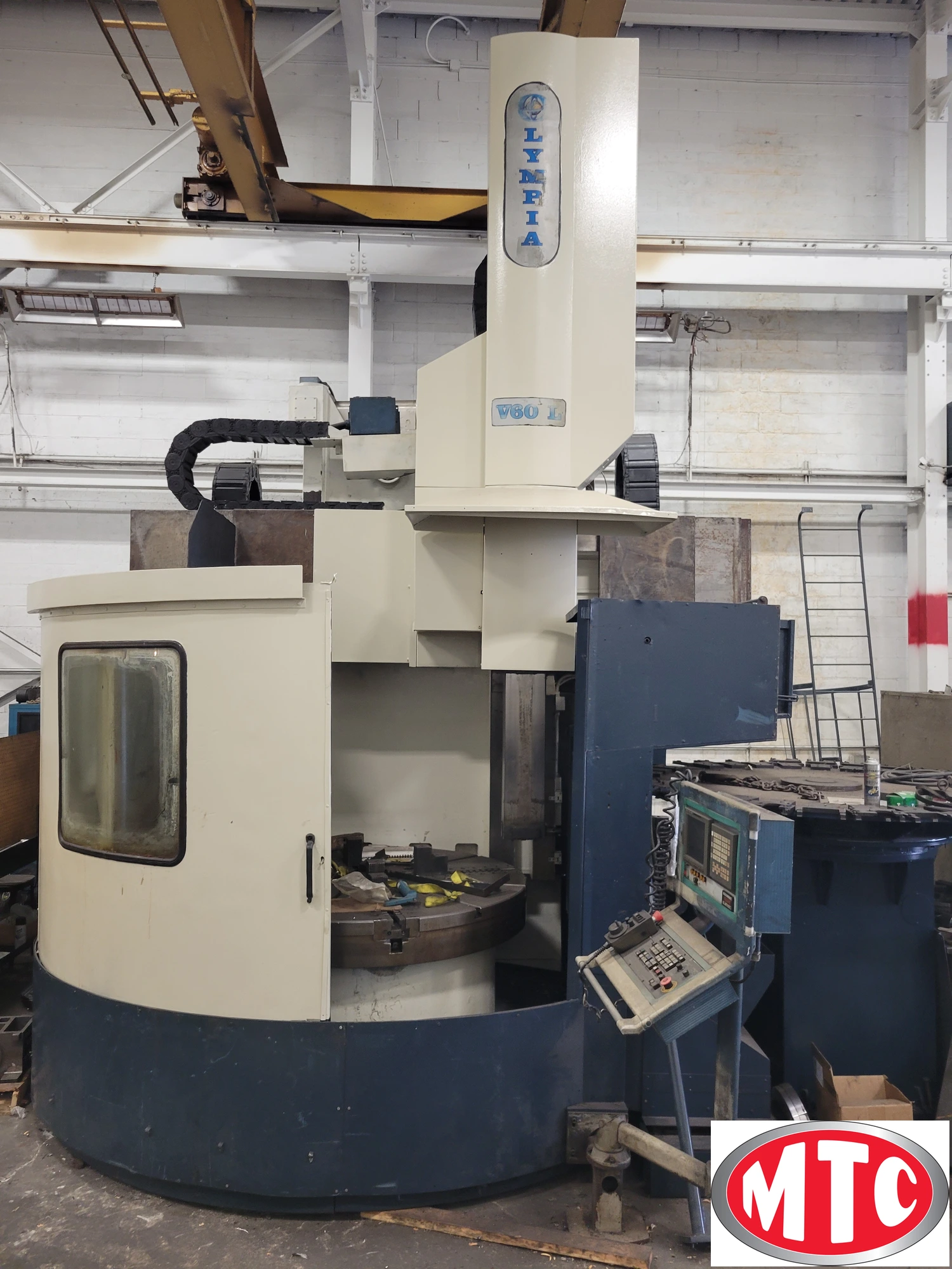 Olympia 70", CNC VTL, Fanuc 180i-T, "C" axis Live tool, 30 ATC, Movable column, 66" table