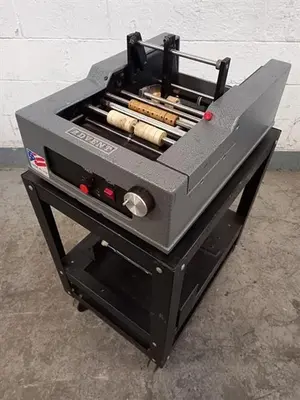 Advent model 310 semi-automatic pressure sensitive wraparound labeler