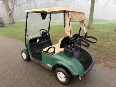 (1) 2015 E-Z-Go golf cart with a Kawasaki gas engine, includes canopy, ball cover, club cover, fold-...