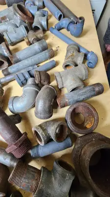 Lot of Plumbing Hardware and Fittings including Galvanized Nipples, Elbows, Valves, and Connectors