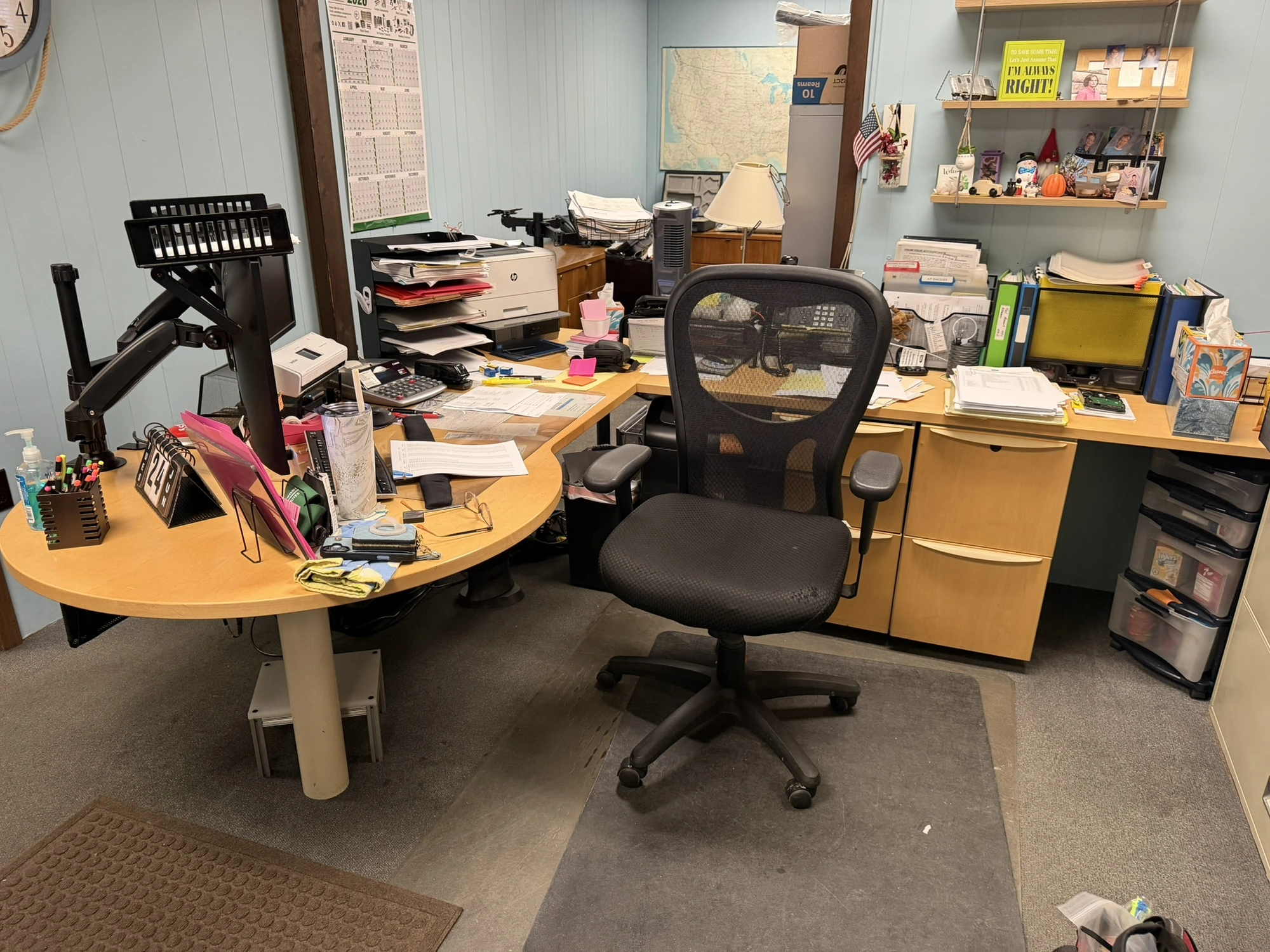 (1) L-shaped wooden desk, approx. 84" x 118" with dual monitor holders, does not include contents, d...