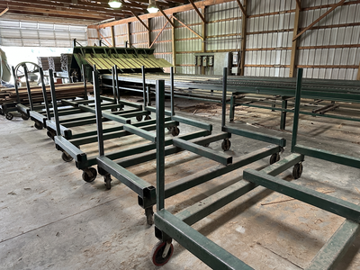 6 strand, 120' green chain with incoming deck and hoist. 24 heavy duty carts