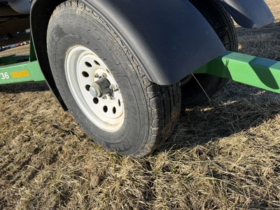 (1) Road Runner 36' dual axle header cart with pin stye hitch, size ST235/85R16 front and rear tires...