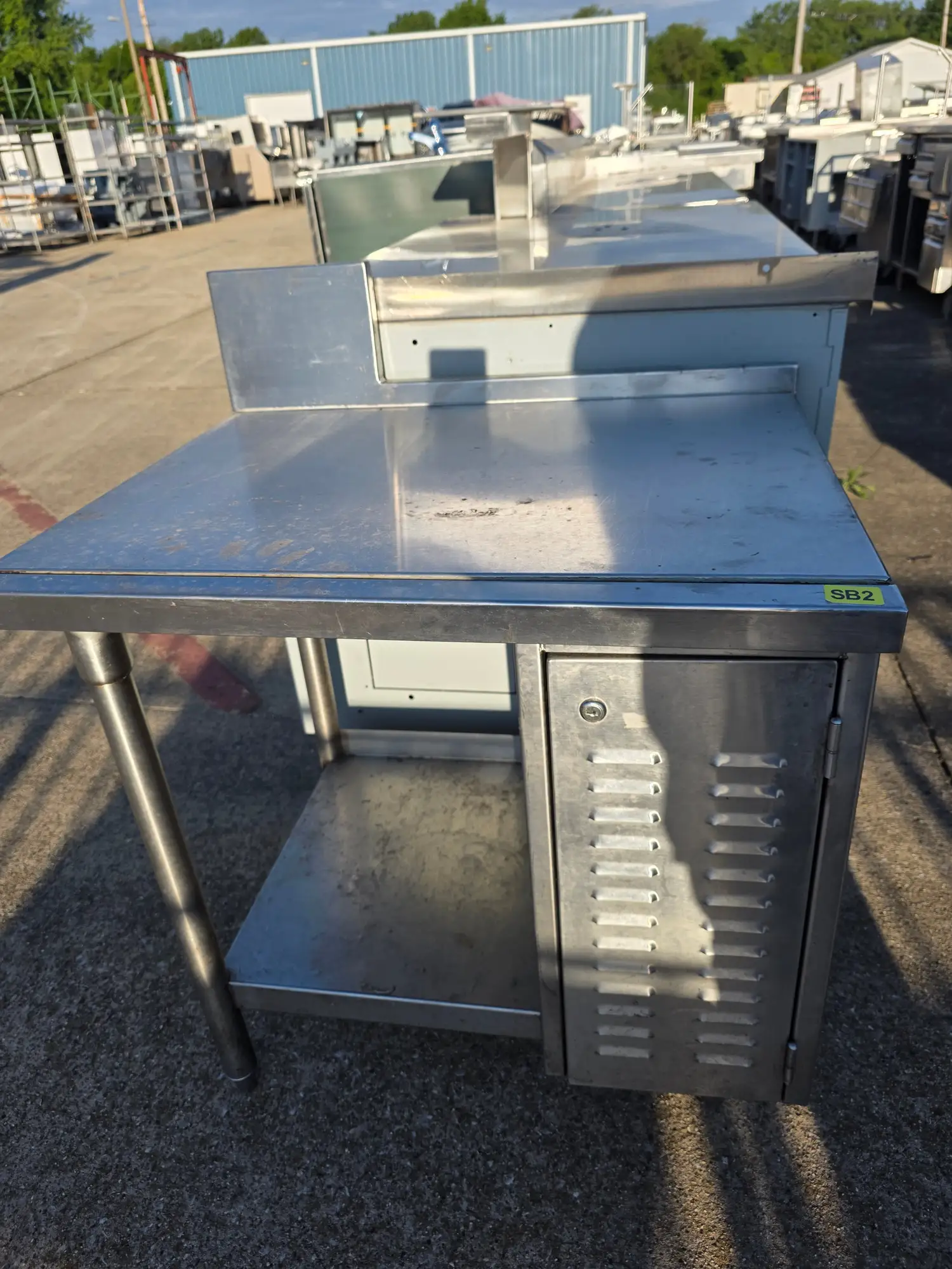 Used Falcon Restaurant Supply, Inc. Used 30"X 24.75" X 30" Stainless Steel Table with Shelf and Small Cabinet - SB2 - SS360 Food Prep Tables Illinois US | Falcon Restaurant Supply #1373772