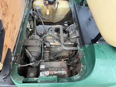 (1) 2015 E-Z-Go golf cart with a Kawasaki gas engine, includes canopy, ball cover, club cover, fold-...