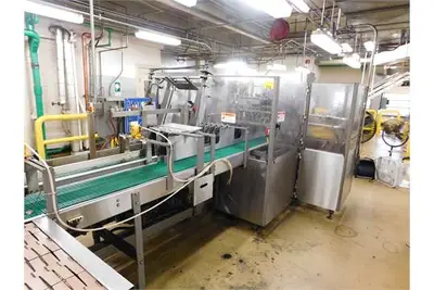Douglas case packer with controls and magazine