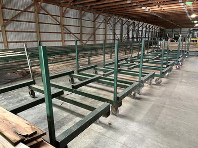 6 strand, 120' green chain with incoming deck and hoist. 24 heavy duty carts
