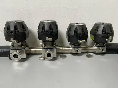 USED 2 ITT 1" & 2 ITT 1/2" 60 PSI VALVES ON MANIFOLD W/ 1/2" & 1" SANITARY FITTINGS