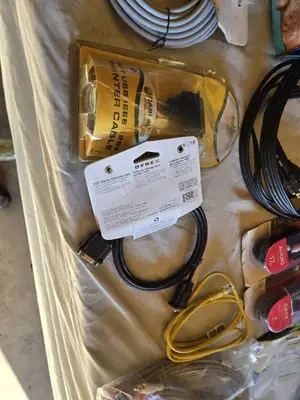 Various audio, video, and network cables, including RCA stereo audio cables, CAT6 network cables, VGA extension cables, USB printer cables, and more.