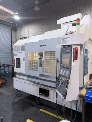 USED 2011 OKUMA GENOS 560V