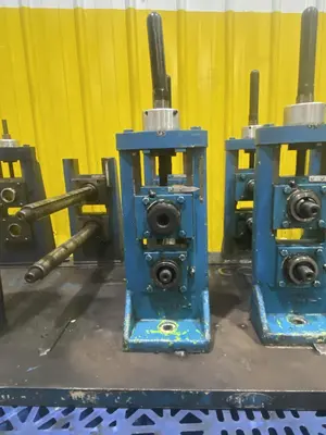 4 STAND X 1.5" X 11" YODER ROLLFORMER STANDS ON 6 STAND RAFTED BASE: STOCK #16781