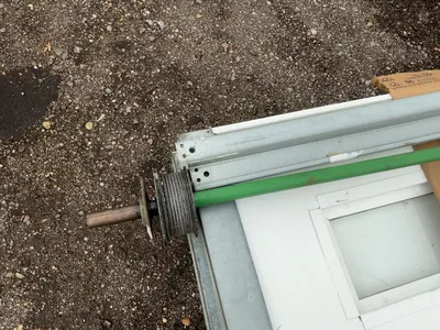 Used 8’ Tall x 10’ Wide Insulated Roll Up Door, comes with tracks, spring, and hardware, four panels...