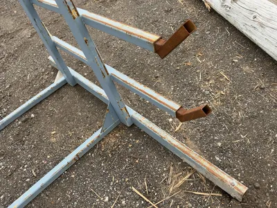 Metal 8-Tier Cantilever Rack, welded together, arms stick out approx. 20” and have metal brackets th...
