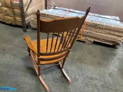 Lot of (2) wooden rocking chairs- brown press back oak rocking chair & black Boston rocker...