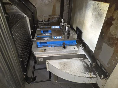 Hyundai HI-V50D VMC w/ 30-Slot ATC, Conveyor, (2) Kurt Vise, Fanuc Oi-MC Controller