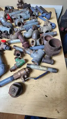 Lot of Plumbing Hardware and Fittings including Galvanized Nipples, Elbows, Valves, and Connectors