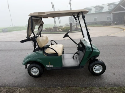 (1) 2015 E-Z-Go golf cart with a Kawasaki gas engine, includes canopy, ball cover, club cover, fold-...