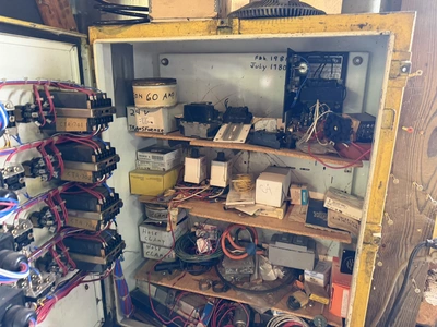 (1) control cabinet filled with assorted electrical items, includes screws, wire, terminals, hose cl...