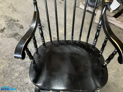 Lot of (2) wooden rocking chairs- brown press back oak rocking chair & black Boston rocker...