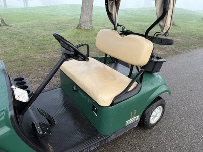 (1) 2015 E-Z-Go golf cart with a Kawasaki gas engine, includes canopy, ball cover, club cover, fold-...