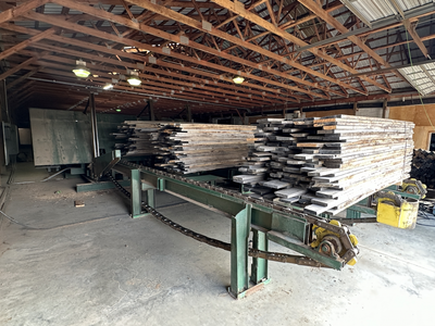 6 strand, 120' green chain with incoming deck and hoist. 24 heavy duty carts
