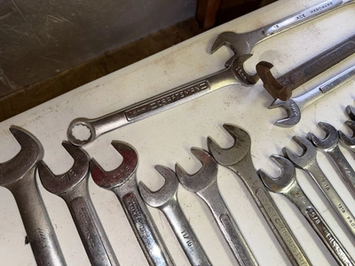 (1) tool box filled with assorted box end wrenches.