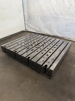 60" WIDE X 67" LONG X 9" THICK T-SLOTTED BOLSTER PLATE. STOCK # 1006324