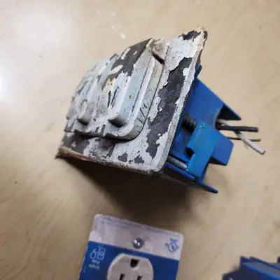 Lot of Electrical Supplies Including Porcelain Pull Chain Lampholders, GE Wall Switch Outlet, and Electrical Boxes