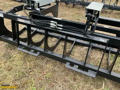 New Tomahawk 78” brush grapple attachment, two hydraulic grapple arms, skid steer quick attach