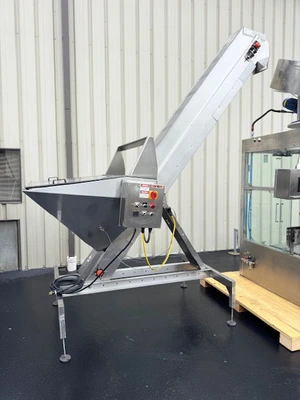 MBF CAPMATIC 9-Head Rotary T-Corker with Hopper Elevator