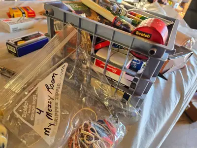 Assorted Office and Craft Supplies including Giant Pencil Decor, Cable Organizer, Glue Stic Foam Cushion Roll, and Miscellaneous Tools