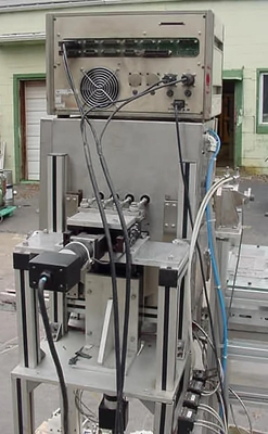 USED FOUR PISTON  HEATED HOT POUR FILLER 4 PISTON HOT POUR