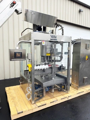 MBF CAPMATIC 9-Head Rotary T-Corker with Hopper Elevator