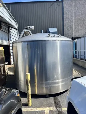 Used approximately 2400 gallon vertical stainless steel sanitary mix tank