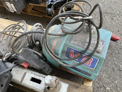 Skid lot of 4 piece swivel casters with bumpers, pulley with cord and remote, a snow scraper, a trac...