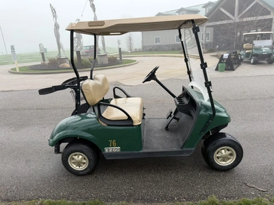 (1) 2014 E-Z-Go golf cart with a Kawasaki gas engine, includes canopy, ball carrier, fold-down winds...