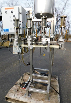 USED FOUR STATION VOLUMETIRIC FILLER FOUR STATION