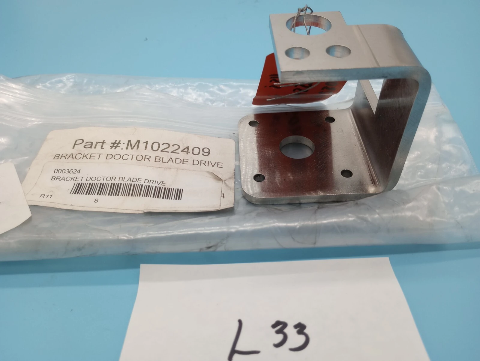 BRACKET DOCTOR BLADE DRIVE M1022409