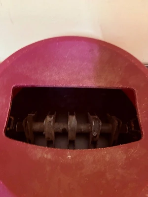 Trash can lid with magnetic silverware catcher