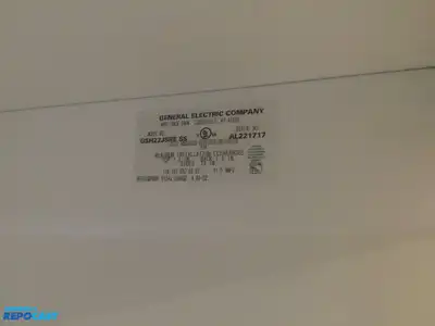 USED GE STAINLESS STEEL AND BLACK SIDE X SIDE REFRIGERATOR HEAVY DUTY ENERGY STAR