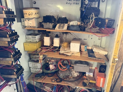 (1) control cabinet filled with assorted electrical items, includes screws, wire, terminals, hose cl...