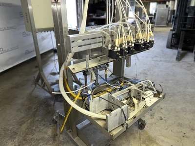 6 Head ELF Filler with feed tanks & container link belt conveyor