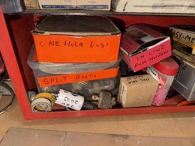 (2) Auto Call single door storage cabinets filled with assorted electrical items, including Push Mat...