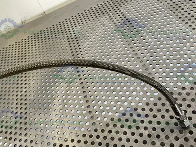 USED 24" STAINLESS STEEL BRAIDED HOSE W/ 1/2" NPT FITTING
