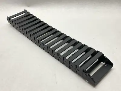 USED IGUS E-CHAIN ASSEMBLY 17-LINKS 1.7FT LENGTH W/ 117.7.P END BRACKET
