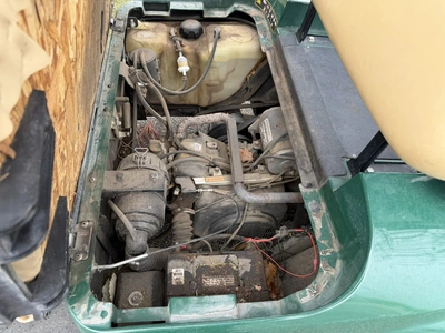 (1) 2015 E-Z-Go golf cart with a Kawasaki gas engine, does not include Club canopy, includes ball wa...