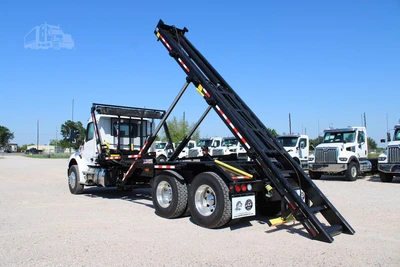 New | in-Stock 2027 PETERBILT 548 Hooklifts & Roll-Offs Texas US | Roll Off Truck World #1492004